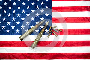 American flag with bullets, shells, cartridges and projectiles on it. Lend-Lease concept.  Army concept. Sales of weapons and