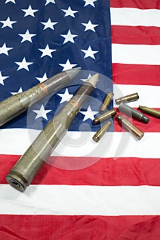 American flag with bullets, shells, cartridges and projectiles on it. Lend-Lease concept.  Army concept. Sales of weapons and