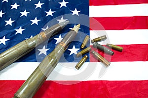 American flag with bullets, shells, cartridges and projectiles on it. Lend-Lease concept.  Army concept. Sales of weapons and