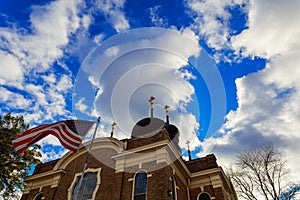 American flag and church steeple