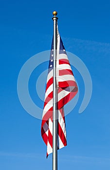 American flag on clear blue sky background