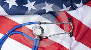 American flag close up with stethoscope. Medicine and health in USA concept