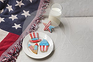 American flag cookies and glass of milk. Holiday sugar cookies on a flag.