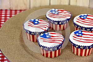 American flag cupcakes on burlap plate