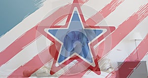 American flag design pattern and pulsating stars over caucasian mother and daughter playing on bed