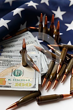 American flag, dollars, bullets, cartridges, ammunition