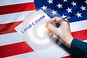 American flag with dollars on it. .Lend-Lease text. Elections in the USA. Woman putting tick on the paper for vote. Political