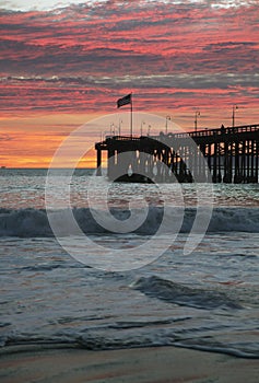 American flag flies over Ventura Pier at sunset, Ventura, California, USA