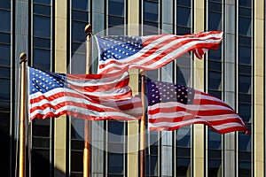 American flag is fluttering in the wind against the background of the building. Concept of patriotism. Flag of USA