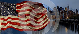 American flag flying the a Skyline New York City manhattan buildings skyline evening taken