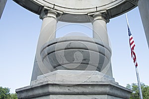 American flag half mast in stone gazebo