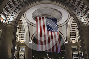 American flag hanging at night from the doom ceiling in Boston Harbor, Massachusetts