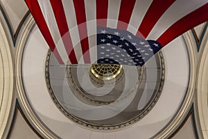 American flag hanging at night from the doom ceiling in Boston Harbor, Massachusetts