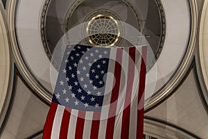 American flag hanging at night from the doom ceiling in Boston Harbor, Massachusetts