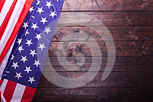 The American Flag Laying on a Wooden Background