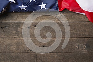 American flag lying on old wooden background