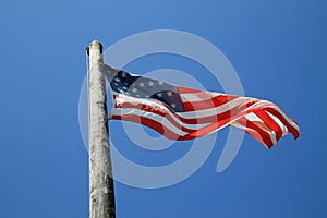 American flag and old pole