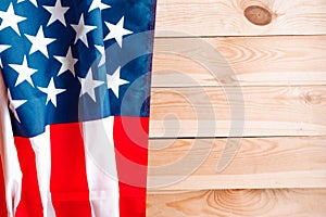 American flag on old wooden background, top view. Copy space for the text.