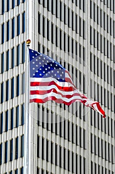 American Flag outside a skyscraper in downtown Detroit