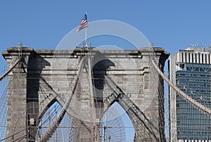 American flag over the pier of Brooklyn Bridge