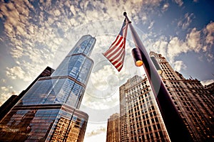 American flag over skyscrapers