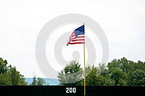 American flag pole in outfield
