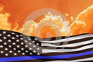 American flag with police support symbol Thin blue line on sunset sky.