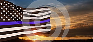 American flag with police support symbol Thin blue line on sunset sky.