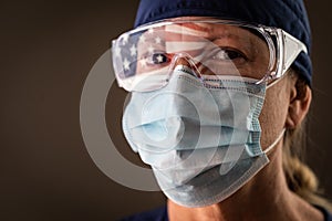 American Flag Reflecting on Female Medical Worker Wearing Protective Face Mask and Goggles