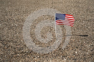 American flag in the road crack