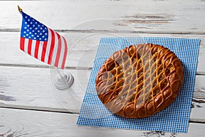 American flag beside round pie.