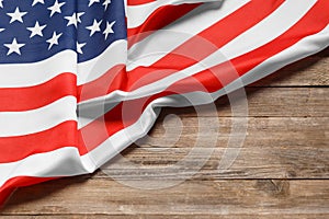 American flag on a rustic wooden background, copy space. Symbol of independence, patriotism