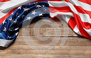 American flag on a rustic wooden background, copy space. Symbol of independence, patriotism