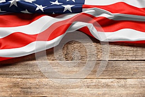 American flag on a rustic wooden background, copy space. Symbol of independence, patriotism