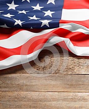 American flag on a rustic wooden background, copy space. Symbol of independence, patriotism