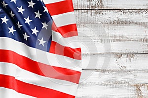 American flag on a rustic wooden background, top view, copy space. Symbol of independence, patriotism