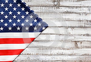 American flag on a rustic wooden background, top view, copy space. Symbol of independence, patriotism