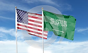 American flag and Saudi Arabia flag on cloudy sky.