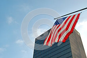 American flag and skyscraper