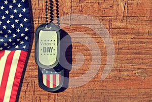 American flag and soldiers tags on wooden background.