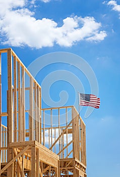 American flag on the top of a construction home framing