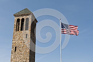 American flag and tower in the sky.