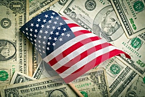 American flag with us dollars