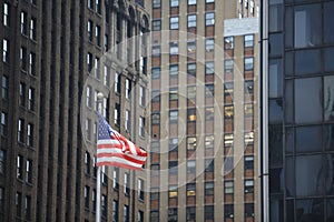 American flag waving in the city