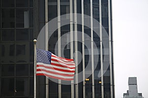 American flag waving in the city