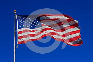 American flag waving in clear sky