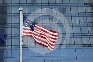 American Flag Waving in the downtown of a major city