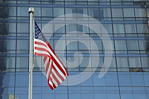 American Flag Waving in the downtown of a major city