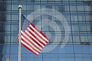 American Flag Waving in the downtown of a major city