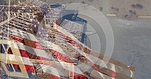 American Flag Waving With Drone Aerial View of New Home Construction Site Background